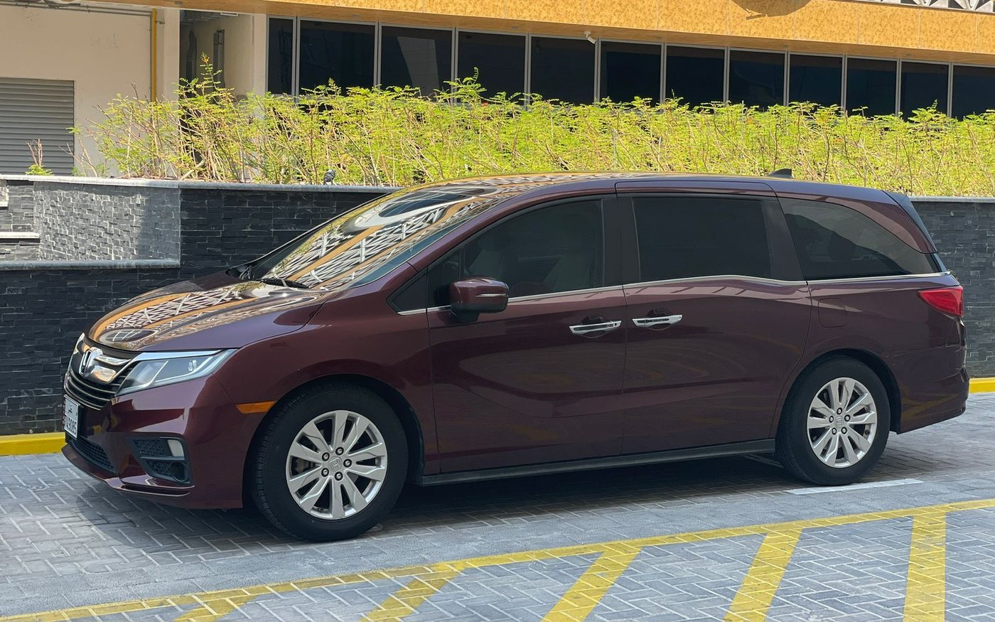 Dunescape's burgundy Honda Odyssey people carrier parked in Doha