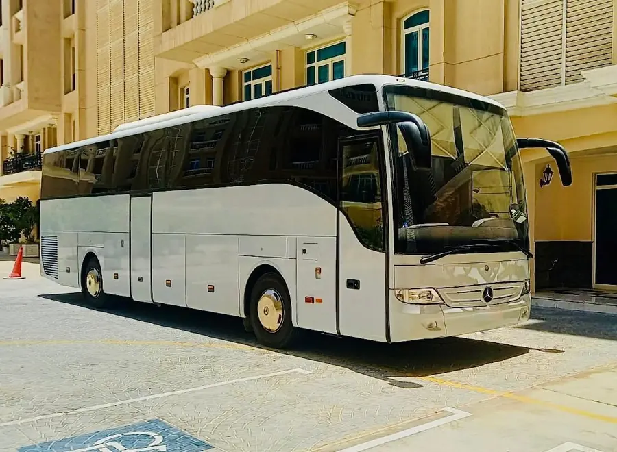 A white Mercedes Tourismo coach ready for a group transfer