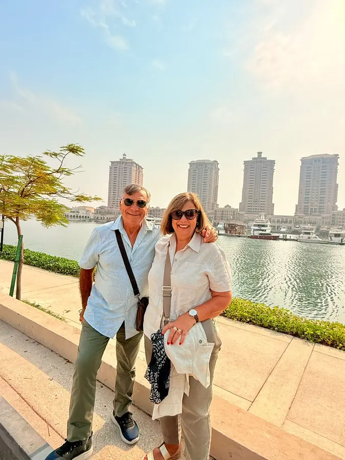 A couple on the waterfront at Porto Arabia, The Pearl