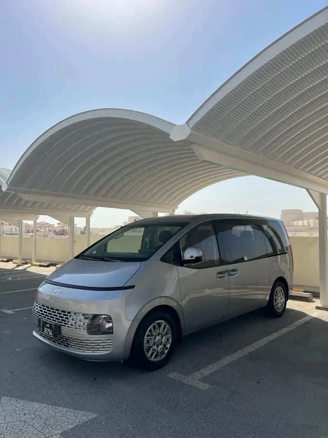 A Hyundai Staria from the Dunescape fleet waiting in the shade